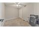 Neutral bedroom with a ceiling fan, carpeted floor, and white closet door at 4073 Hickory Fairway Dr, Woodstock, GA 30188