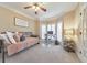 Cozy bedroom with large windows, neutral carpet, a ceiling fan and a versatile daybed at 4073 Hickory Fairway Dr, Woodstock, GA 30188