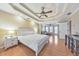 Primary bedroom boasts a trey ceiling, hardwood floors, and a sitting area visible through the doorway at 4073 Hickory Fairway Dr, Woodstock, GA 30188