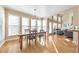 Bright breakfast area features hardwood floors, large windows, and access to the living room at 4073 Hickory Fairway Dr, Woodstock, GA 30188