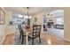 Open dining room with hardwood floors that looks into the living room and kitchen at 4073 Hickory Fairway Dr, Woodstock, GA 30188