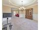 Dining room featuring chair rail, recessed lights, chandelier, and large cabinet for storage at 4073 Hickory Fairway Dr, Woodstock, GA 30188