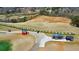 Aerial shot of a driving range featuring players, golf carts, and a food truck at 4073 Hickory Fairway Dr, Woodstock, GA 30188