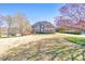 Charming two-story brick home featuring a well-manicured lawn and a welcoming entrance at 4073 Hickory Fairway Dr, Woodstock, GA 30188