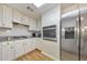 Modern kitchen features stainless steel appliances, granite countertops, and white cabinets at 4073 Hickory Fairway Dr, Woodstock, GA 30188