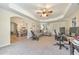 Spacious living room with tray ceiling that opens to the dining area at 4073 Hickory Fairway Dr, Woodstock, GA 30188