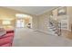 Spacious open-concept with staircase, recessed lighting and neutral carpet and paint throughout at 4073 Hickory Fairway Dr, Woodstock, GA 30188