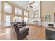 Grand living room featuring high ceilings, fireplace, and large windows at 4073 Hickory Fairway Dr, Woodstock, GA 30188