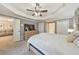 Spacious bedroom suite with tray ceilings, natural light, and an ensuite bathroom at 4073 Hickory Fairway Dr, Woodstock, GA 30188