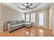 Sitting area with hardwood floors, shuttered windows and a gray couch at 4073 Hickory Fairway Dr, Woodstock, GA 30188