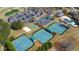 Aerial view showcasing tennis courts, basketball court, and community pool at 4073 Hickory Fairway Dr, Woodstock, GA 30188