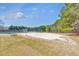 Community volleyball court with a sandy surface and picnic tables at 4073 Hickory Fairway Dr, Woodstock, GA 30188