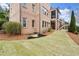 Expansive backyard featuring a well-manicured lawn and a multi-level deck perfect for outdoor entertaining at 13142 Overlook Pass, Roswell, GA 30075