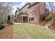 Lush backyard with a manicured lawn, stone stairs, perfect for outdoor activities at 13142 Overlook Pass, Roswell, GA 30075