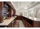 Open bar with granite countertops, sleek cabinets, and beverage cooler, perfect for entertaining guests at 13142 Overlook Pass, Roswell, GA 30075