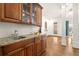 Bar area features elegant cabinetry, granite countertops, and ample storage for beverages at 13142 Overlook Pass, Roswell, GA 30075
