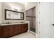 Bathroom with double vanity, granite countertop, large mirror and tiled walk-in shower at 13142 Overlook Pass, Roswell, GA 30075
