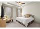 Bright bedroom featuring a plush bed, neutral decor, and large windows with natural light at 13142 Overlook Pass, Roswell, GA 30075