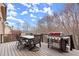 Outdoor deck featuring a dining table and grill perfect for entertaining at 13142 Overlook Pass, Roswell, GA 30075