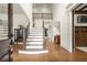 Bright foyer with staircase, hardwood floors, and high ceilings at 13142 Overlook Pass, Roswell, GA 30075