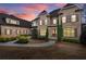 Elegant brick home with a stately front entrance, manicured landscaping, and a welcoming pathway at 13142 Overlook Pass, Roswell, GA 30075