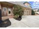 Exterior of home with attached three-car garage and manicured landscaping at 13142 Overlook Pass, Roswell, GA 30075
