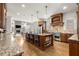 Spacious kitchen with granite countertops, stainless steel appliances, and a large central island at 13142 Overlook Pass, Roswell, GA 30075