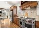 Gourmet kitchen featuring a stainless steel oven range and hood at 13142 Overlook Pass, Roswell, GA 30075
