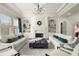 Elegant living room with high ceilings, fireplace, and comfortable seating arrangement at 13142 Overlook Pass, Roswell, GA 30075