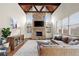 Comfortable living room with stone fireplace, built-in bookshelves, and ample natural light at 13142 Overlook Pass, Roswell, GA 30075