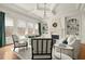 Bright living room featuring fireplace, built-in shelves, recessed lighting, and a decorative chandelier at 13142 Overlook Pass, Roswell, GA 30075