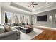 Spacious living room with hardwood floors, tray ceilings, and abundant natural light at 13142 Overlook Pass, Roswell, GA 30075