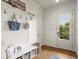 Mudroom features bench seating, storage, hooks, and exterior door at 13142 Overlook Pass, Roswell, GA 30075