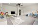 Open playroom with carpet, natural light, ceiling fan, storage, and room to play at 13142 Overlook Pass, Roswell, GA 30075
