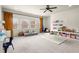 Spacious playroom with carpet, natural light, ceiling fan, storage, curtains, and room to play at 13142 Overlook Pass, Roswell, GA 30075