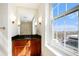 Bathroom vanity with sink, mirror and a window overlooking the city at 195 14Th Ne St # Ph 306, Atlanta, GA 30309