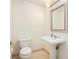 Powder room with pedestal sink, modern fixtures and bright lighting at 195 14Th Ne St # Ph 306, Atlanta, GA 30309