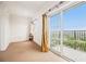 Bedroom with balcony access and sliding glass doors that let in ample light at 195 14Th Ne St # Ph 306, Atlanta, GA 30309