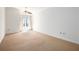 Bright bedroom featuring neutral carpet, ceiling fan, and a large window with natural light at 195 14Th Ne St # Ph 306, Atlanta, GA 30309