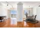 Open dining area with hardwood floors, a modern chandelier, and access to the balcony at 195 14Th Ne St # Ph 306, Atlanta, GA 30309