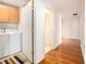 Hallway view of laundry room with washer and dryer, and hardwood floors in the hallway at 195 14Th Ne St # Ph 306, Atlanta, GA 30309