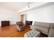 Bright living room featuring hardwood floors, designer furniture, and ample space for relaxation at 195 14Th Ne St # Ph 306, Atlanta, GA 30309