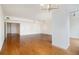 Spacious living room with hardwood floors and recessed lighting fixtures at 195 14Th Ne St # Ph 306, Atlanta, GA 30309