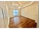 Bedroom with a fan, hardwood floors, and lots of natural light at 2695 Lindsey Oak Ln, Lawrenceville, GA 30044
