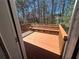 Back deck overlooking a wooded area with a bench at 2695 Lindsey Oak Ln, Lawrenceville, GA 30044