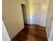 Hallway with hardwood floors and white doorframes at 2565 Lindsey Oak Ln, Lawrenceville, GA 30044