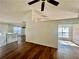 Spacious living room with hardwood floors and natural light streaming through the windows at 2695 Lindsey Oak Ln, Lawrenceville, GA 30044