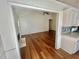 Living room and Kitchen combo with wood floors at 2695 Lindsey Oak Ln, Lawrenceville, GA 30044