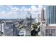 Aerial view of a cityscape featuring a high rise apartment building with a unique design at 45 Ivan Allen Jr Nw Blvd # 1704, Atlanta, GA 30308
