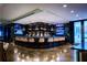 Well-lit bar area offering ample seating and modern lighting fixtures above the bar at 45 Ivan Allen Jr Nw Blvd # 1704, Atlanta, GA 30308